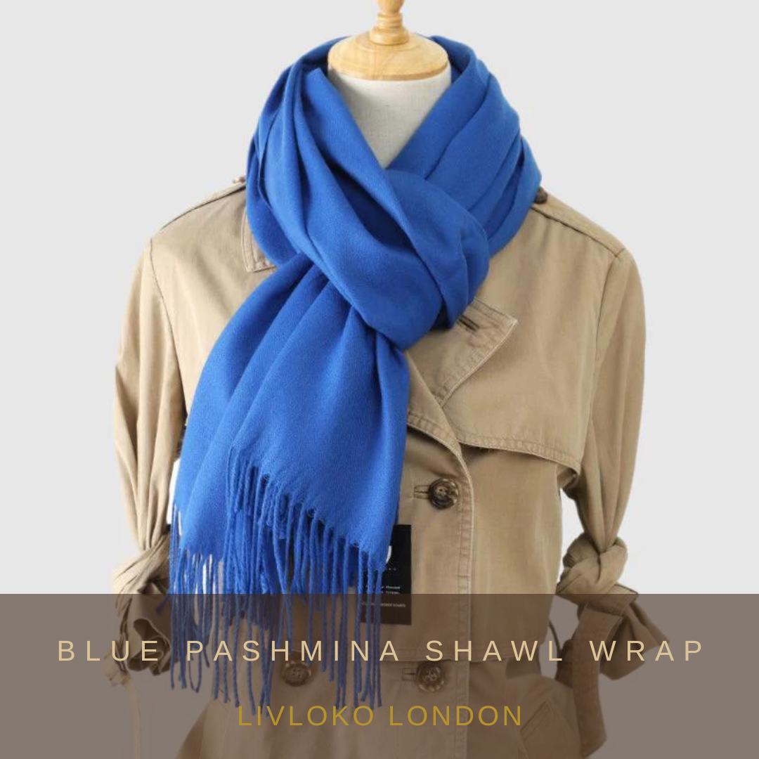 Blue pashmina shawl wrap draped over a neutral background