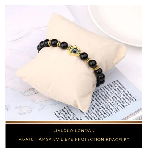 Agate bracelet with Hamsa hand and evil eye charm on the wrist