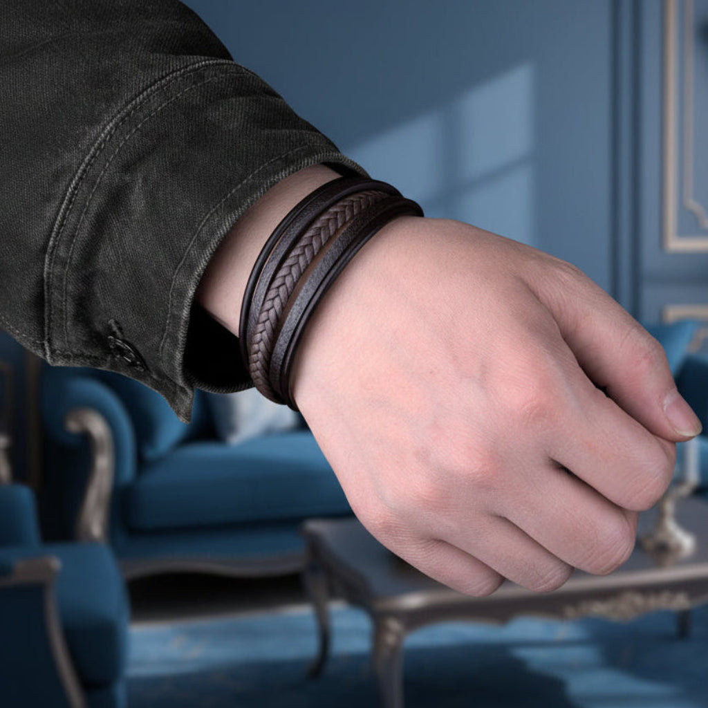 Brown braided leather bracelet worn on men’s wrist with casual jacket