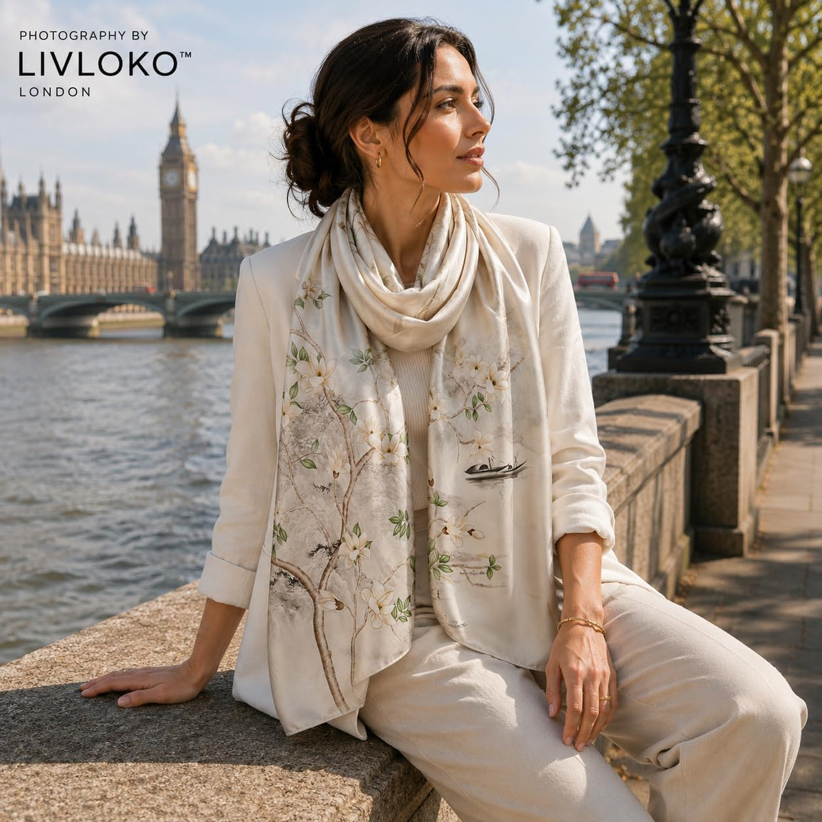 Woman wearing Spring Branches floral 100% mulberry silk scarf, LIVLOKO LONDON