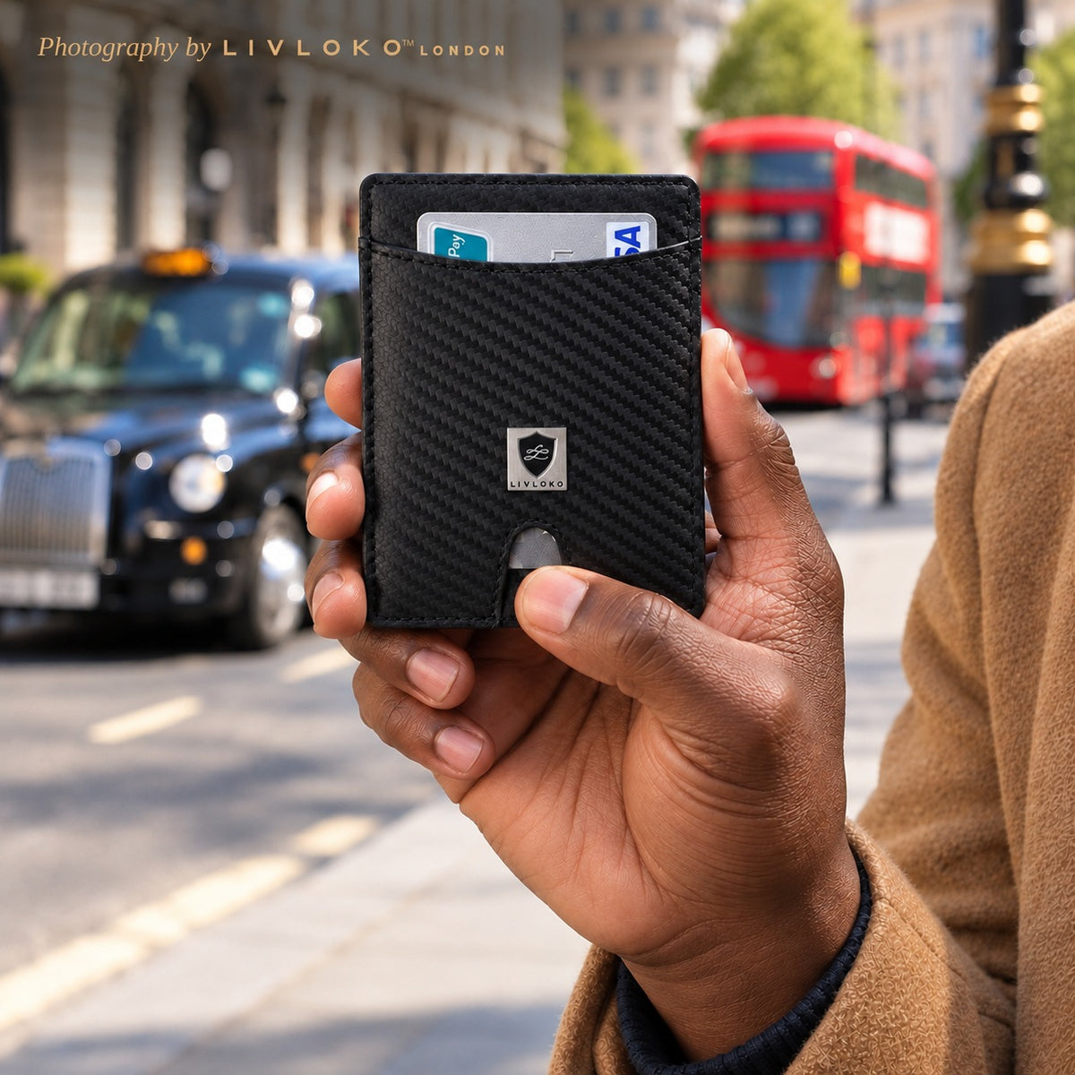 Man holding the carbon fibre style card wallet on a London street