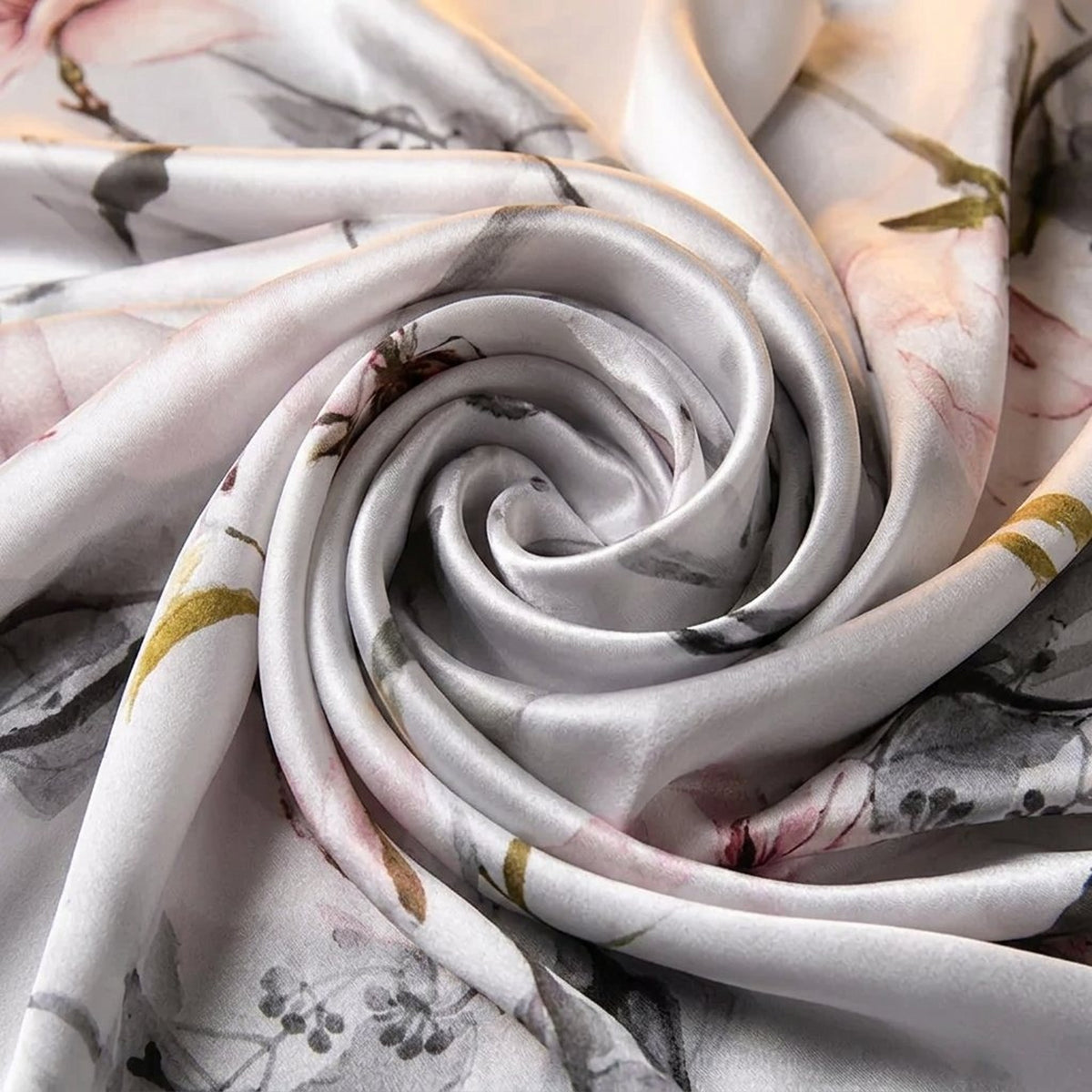 Close-up of the silver satin scarf swirled to show the soft floral print