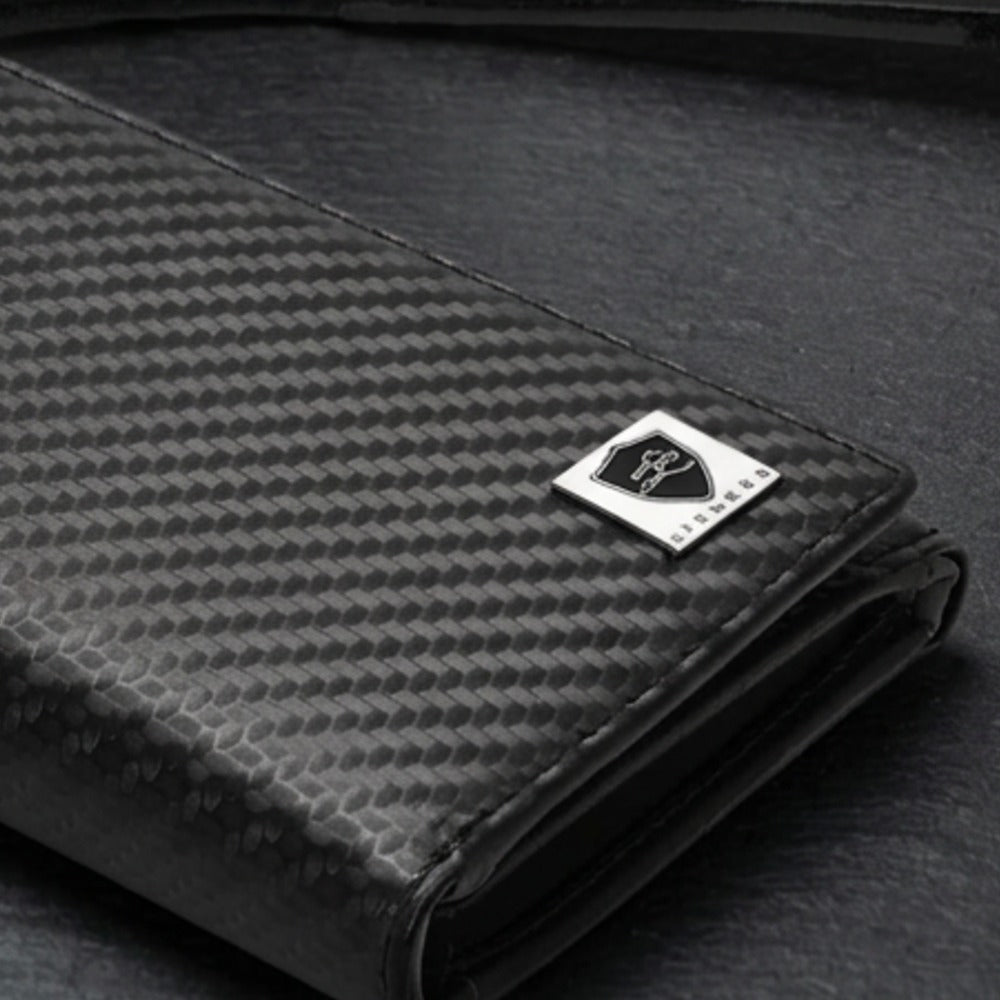 Close-up of the LIVLOKO London black carbon fibre bifold wallet showing the LIVLOKO shield badge