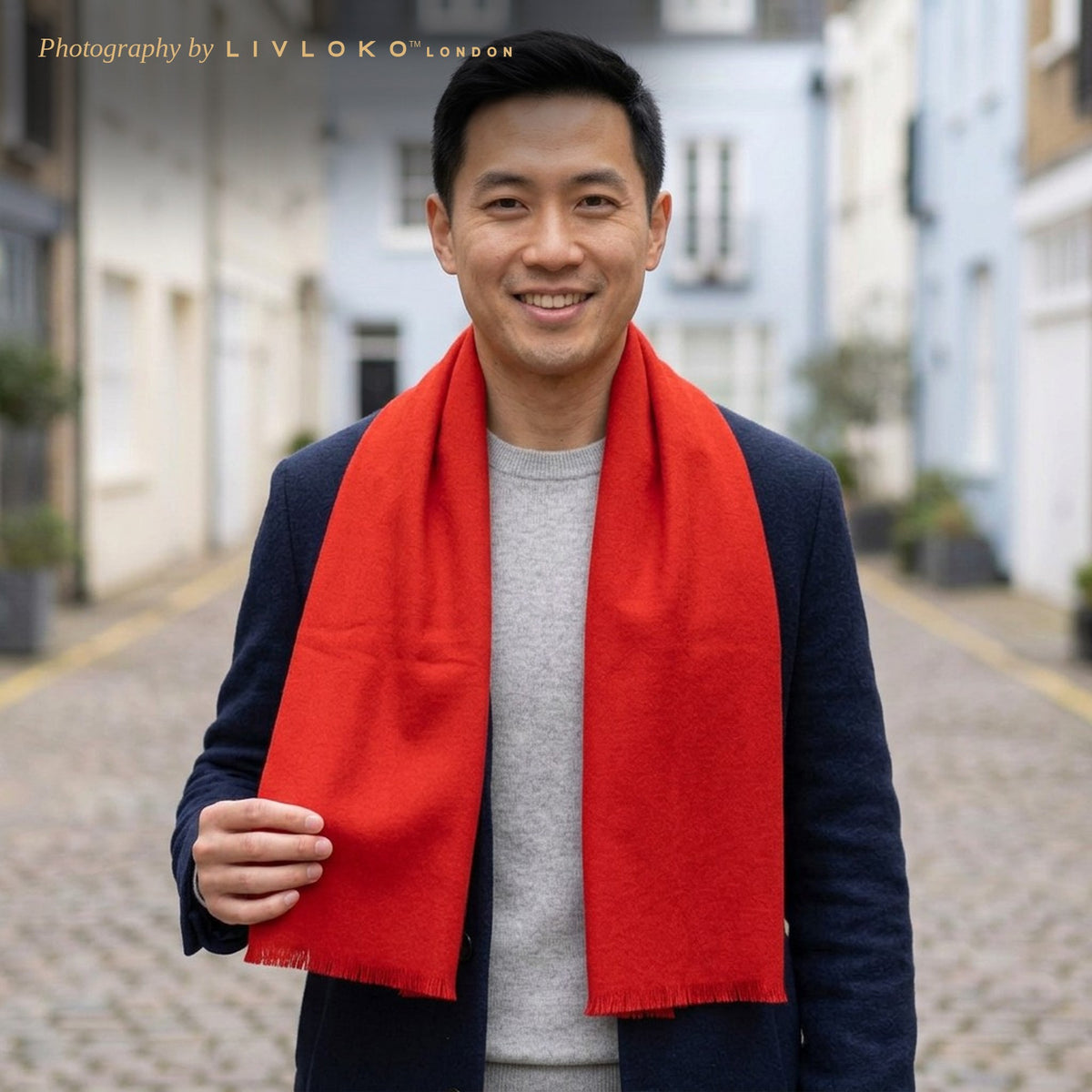 Man wearing the Livloko London men's red wool scarf with a navy coat on a London mews