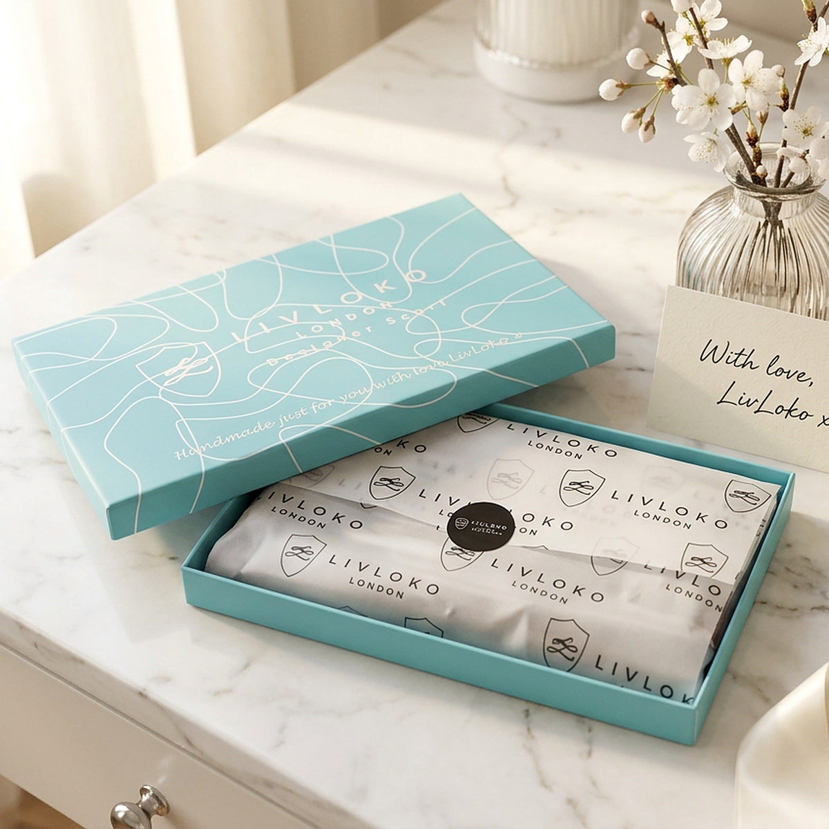 LIVLOKO London turquoise scarf gift box with branded tissue paper, ready to give as a gift for her