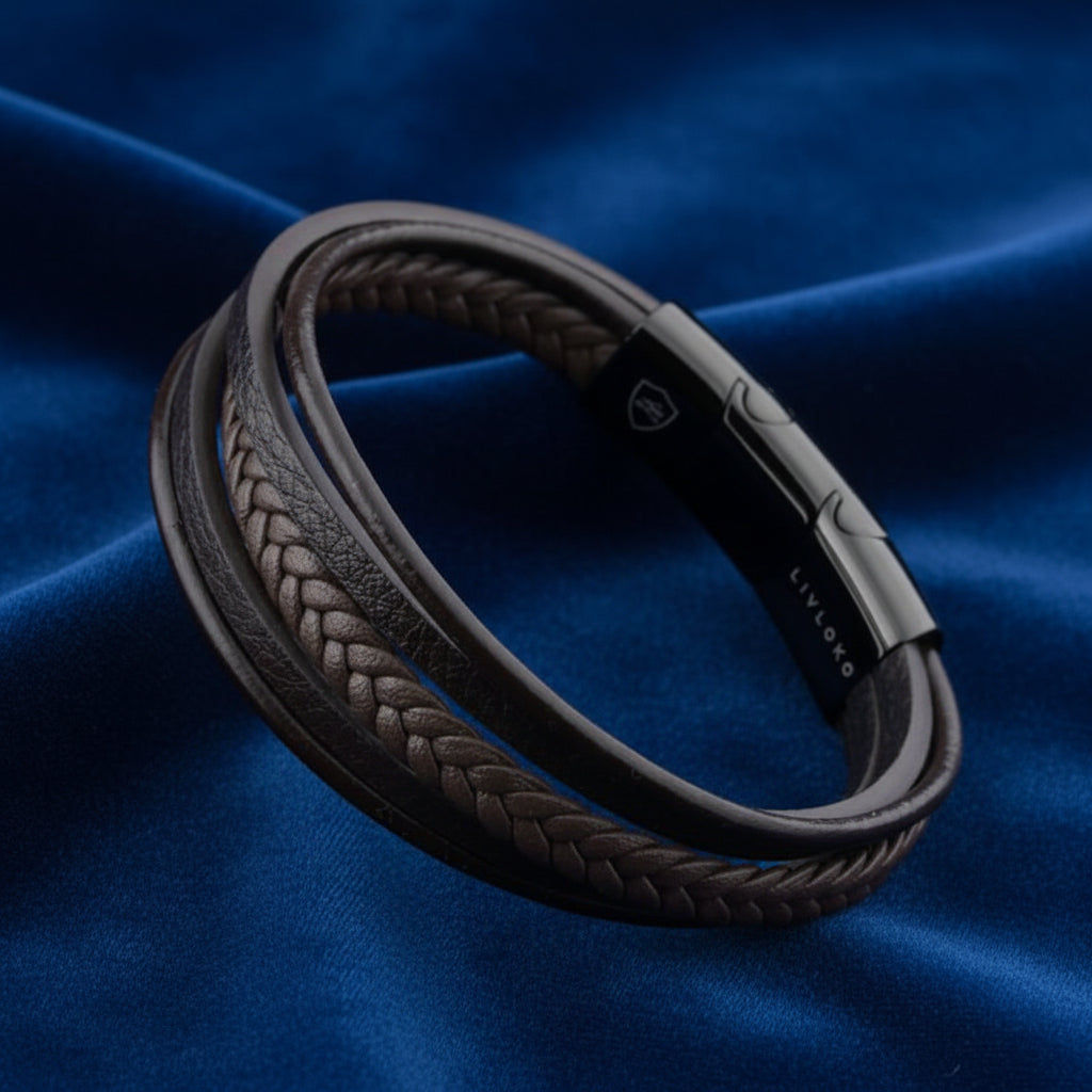 Close view of layered brown leather bracelet showing braided and smooth bands