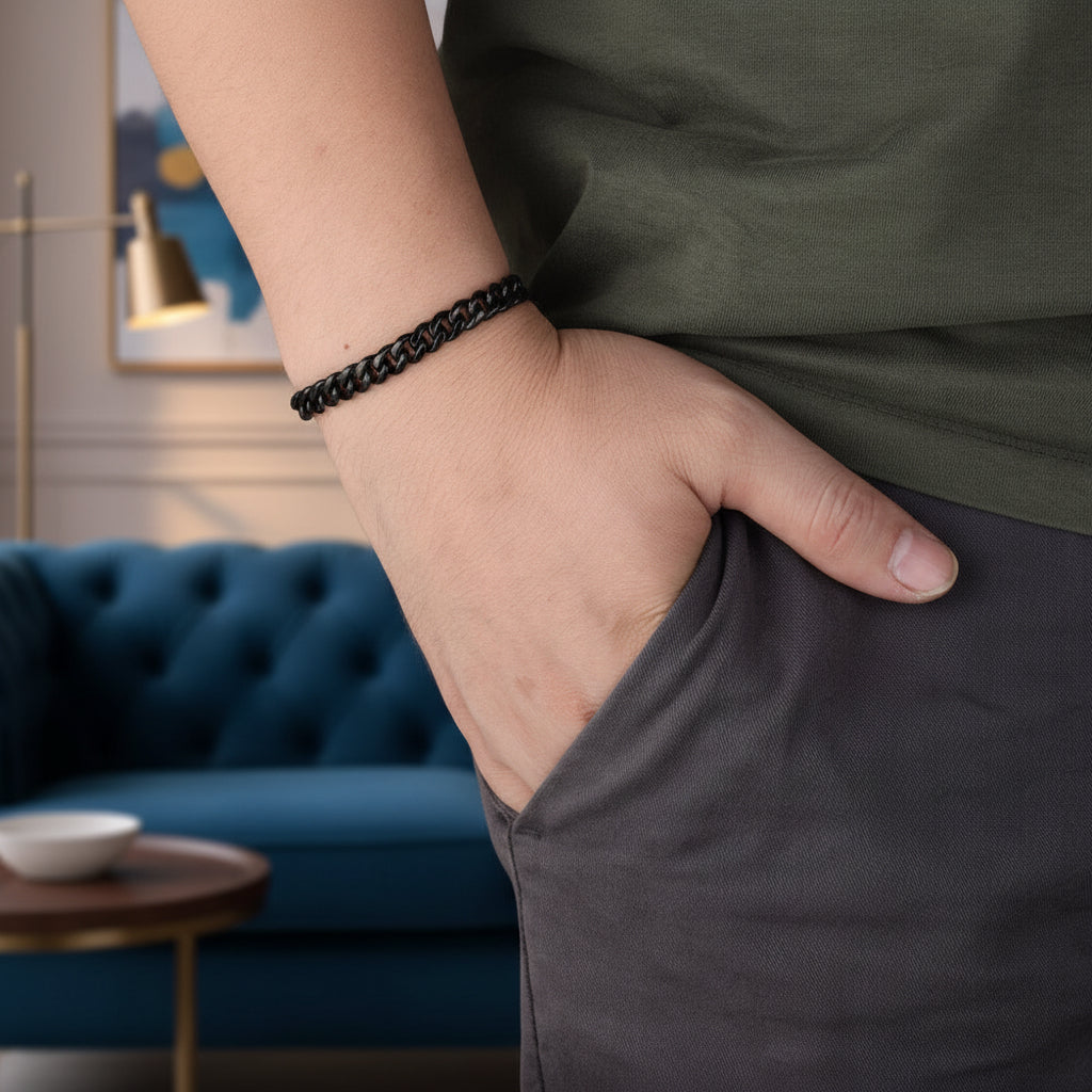 Man wearing black stainless steel Cuban link bracelet on wrist