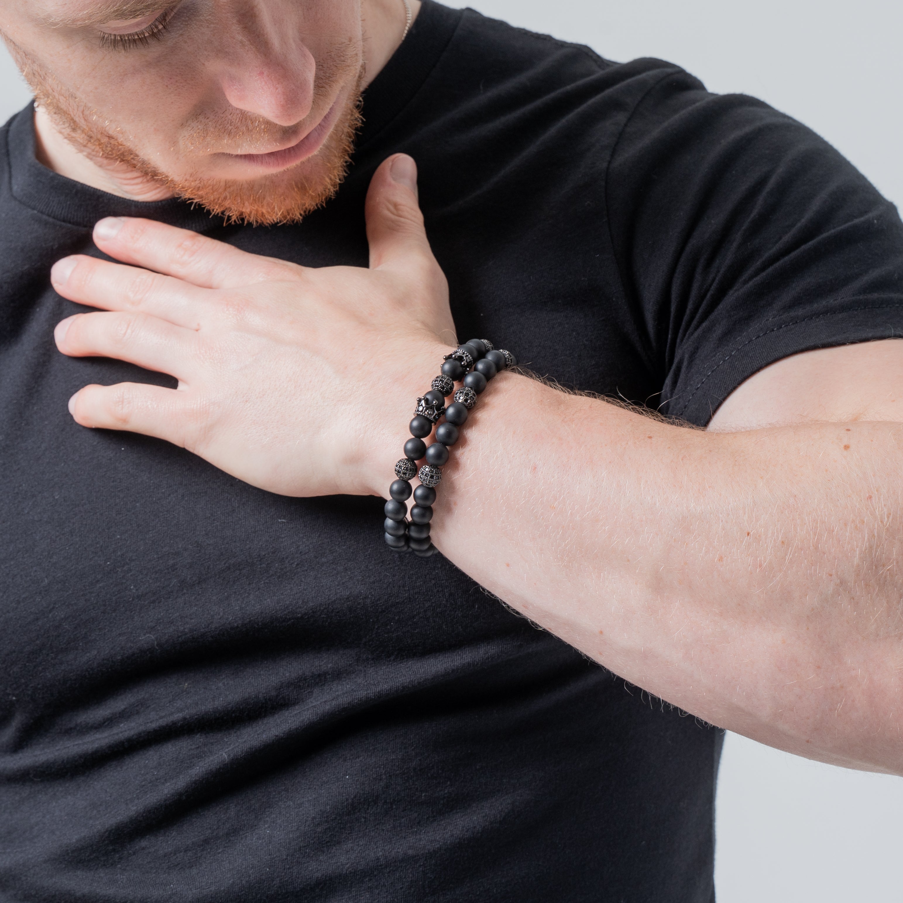 man wearing black agate beaded bracelet