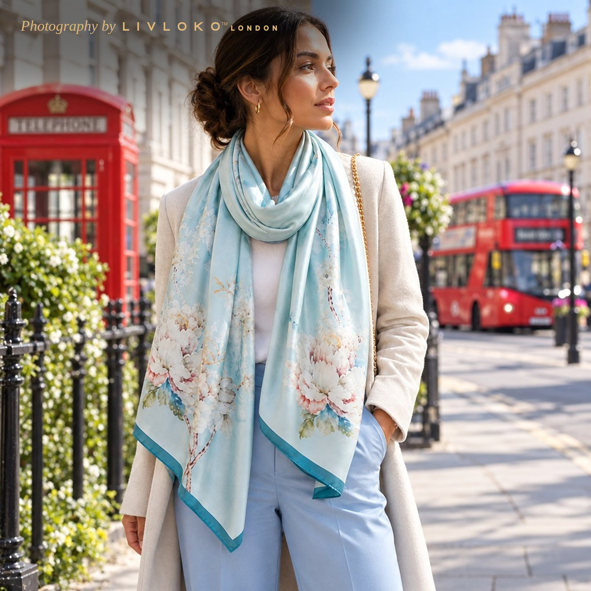 Woman wearing the light blue floral blossom silk scarf on a London street