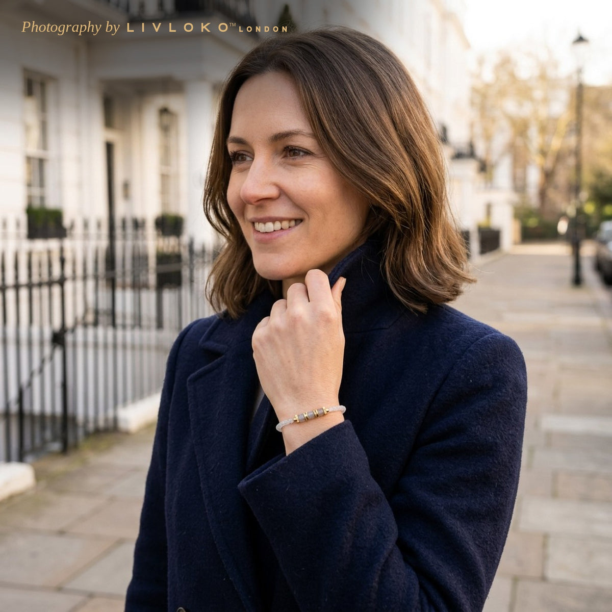 Woman wearing the Livloko London labradorite gold plated bracelet on a Belgravia street in London