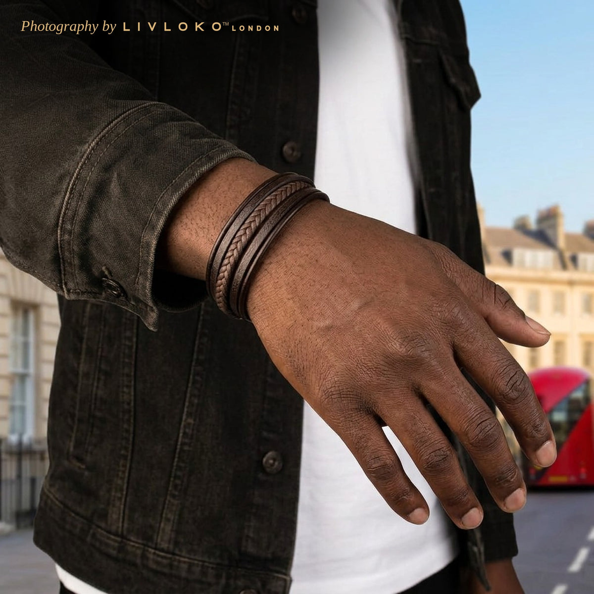 Man wearing the men's brown braided leather bracelet with a black denim jacket in London