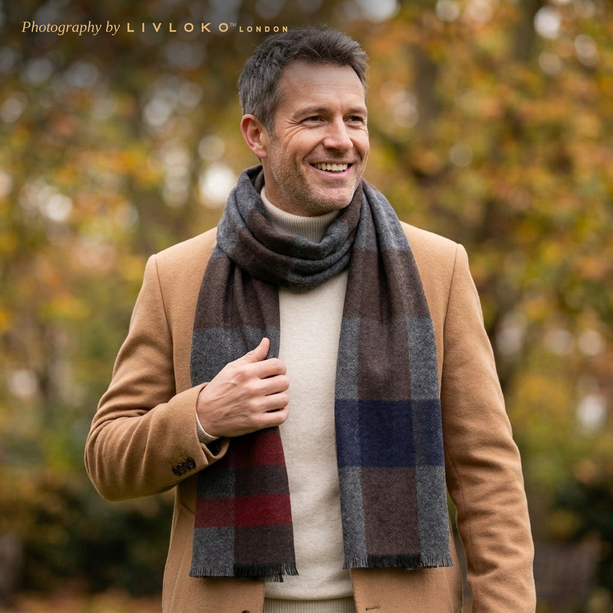 Man wearing the Livloko London men's grey and brown check wool scarf with a camel coat in a London square