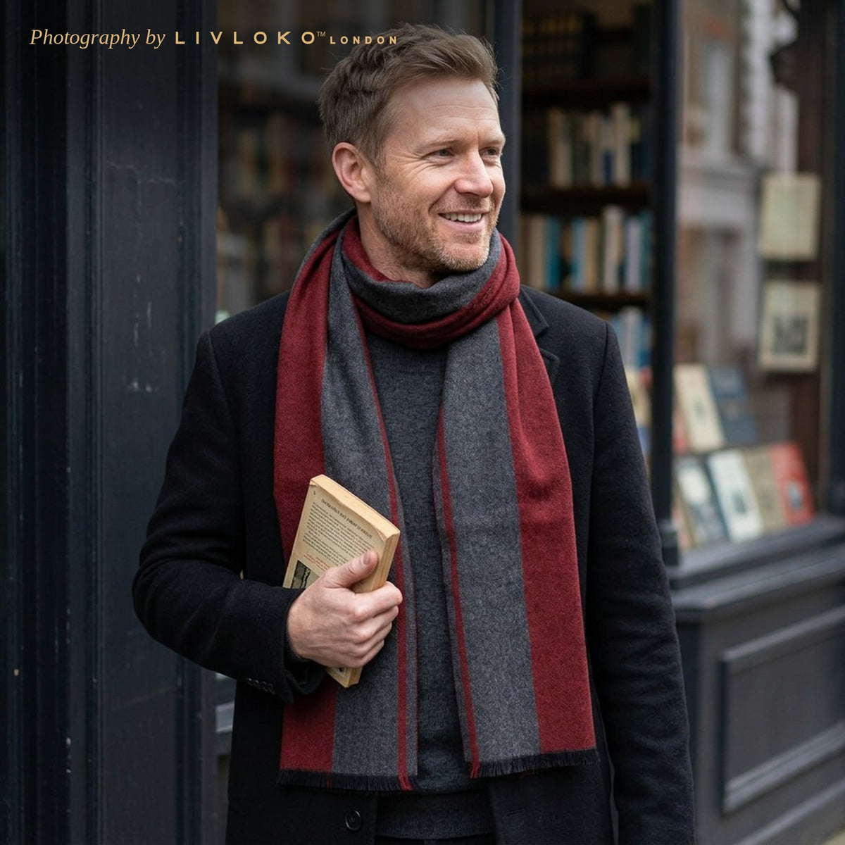 Man wearing the Livloko London men's maroon and grey striped wool scarf outside a London bookshop