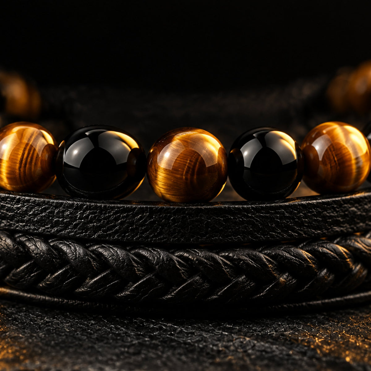 Close-up of tiger eye and black agate beads on the men's leather bracelet