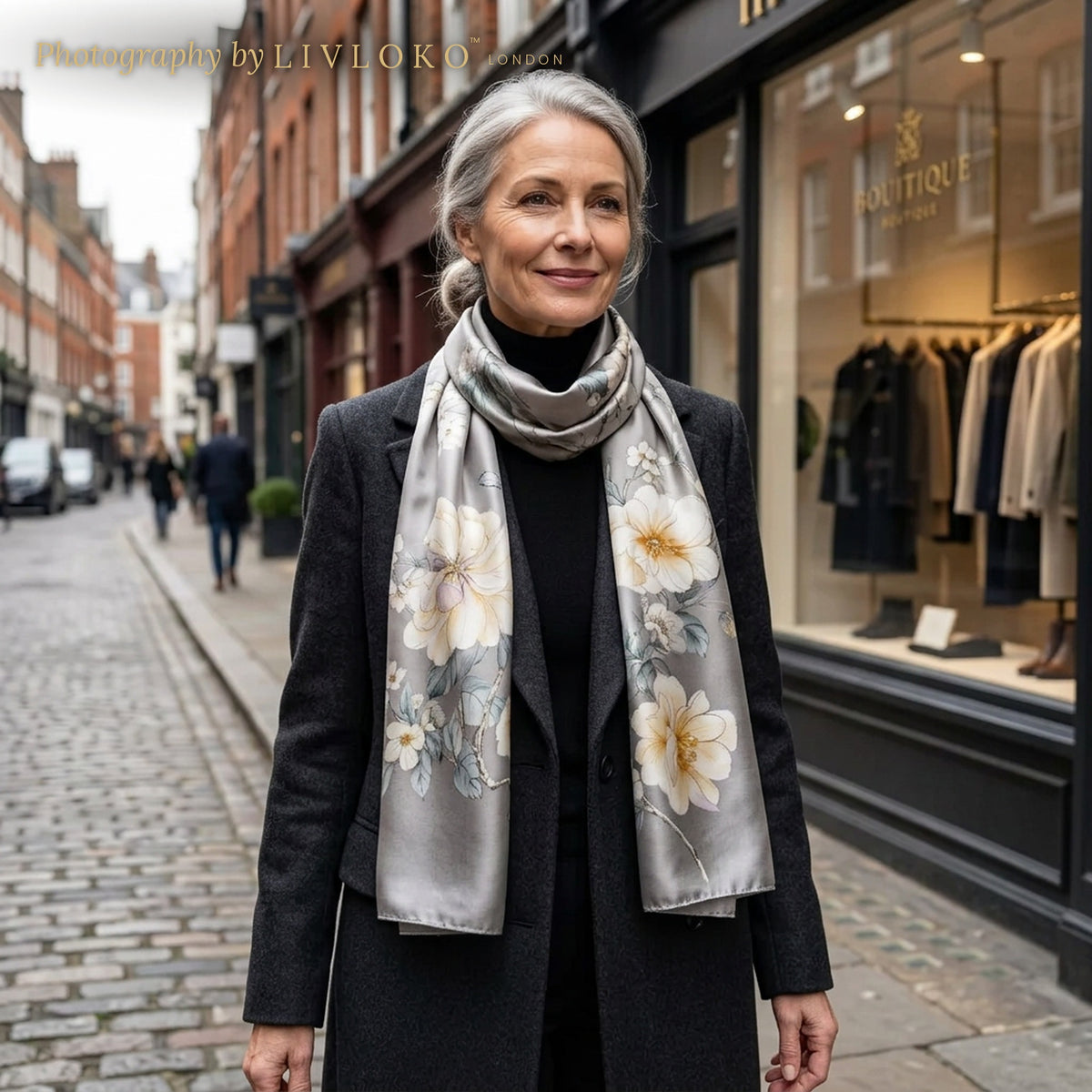 Woman wearing the Midnight Blossom grey floral mulberry silk scarf in Marylebone, London, LIVLOKO LONDON