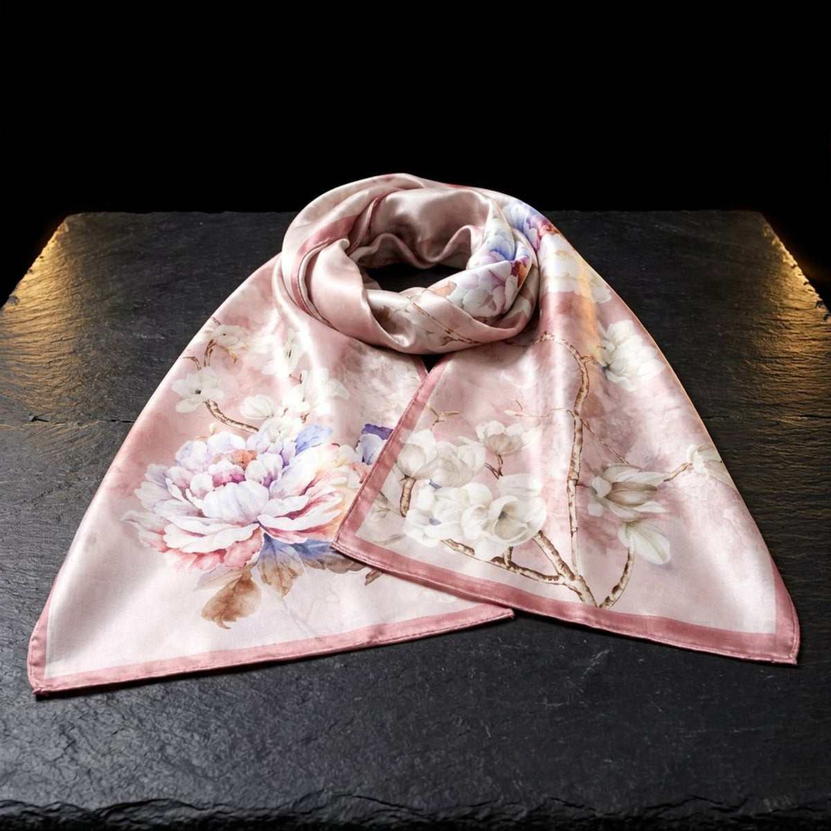 Rose Garden pink floral silk scarf for women in 12 momme mulberry silk, laid on dark slate
