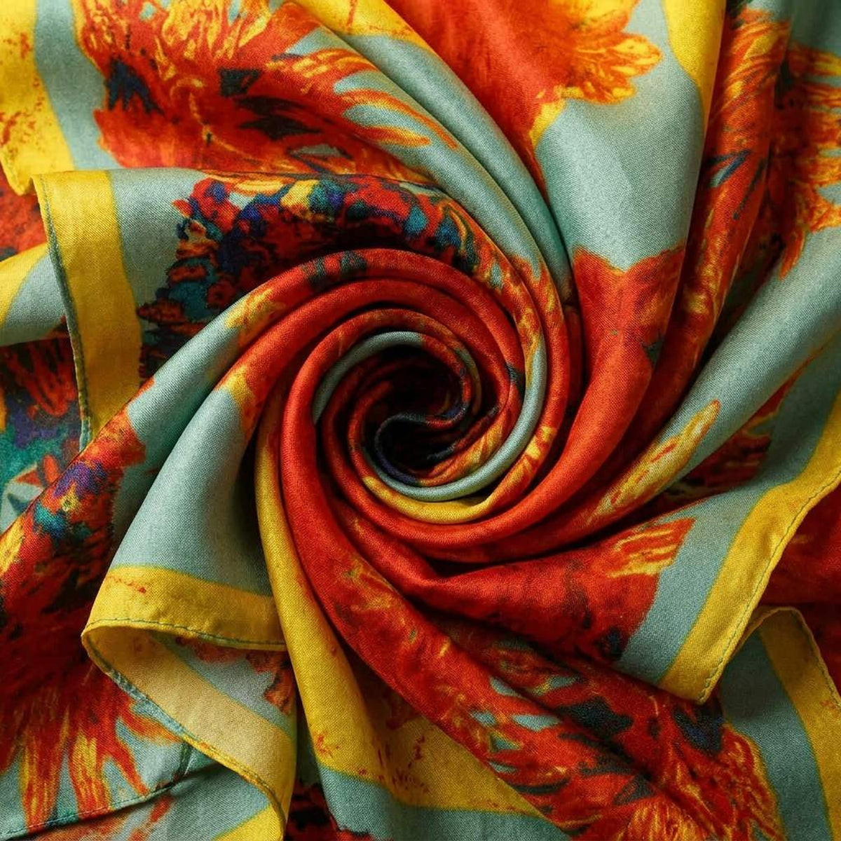 Close-up of the sunflower satin scarf swirled to show the bright floral print