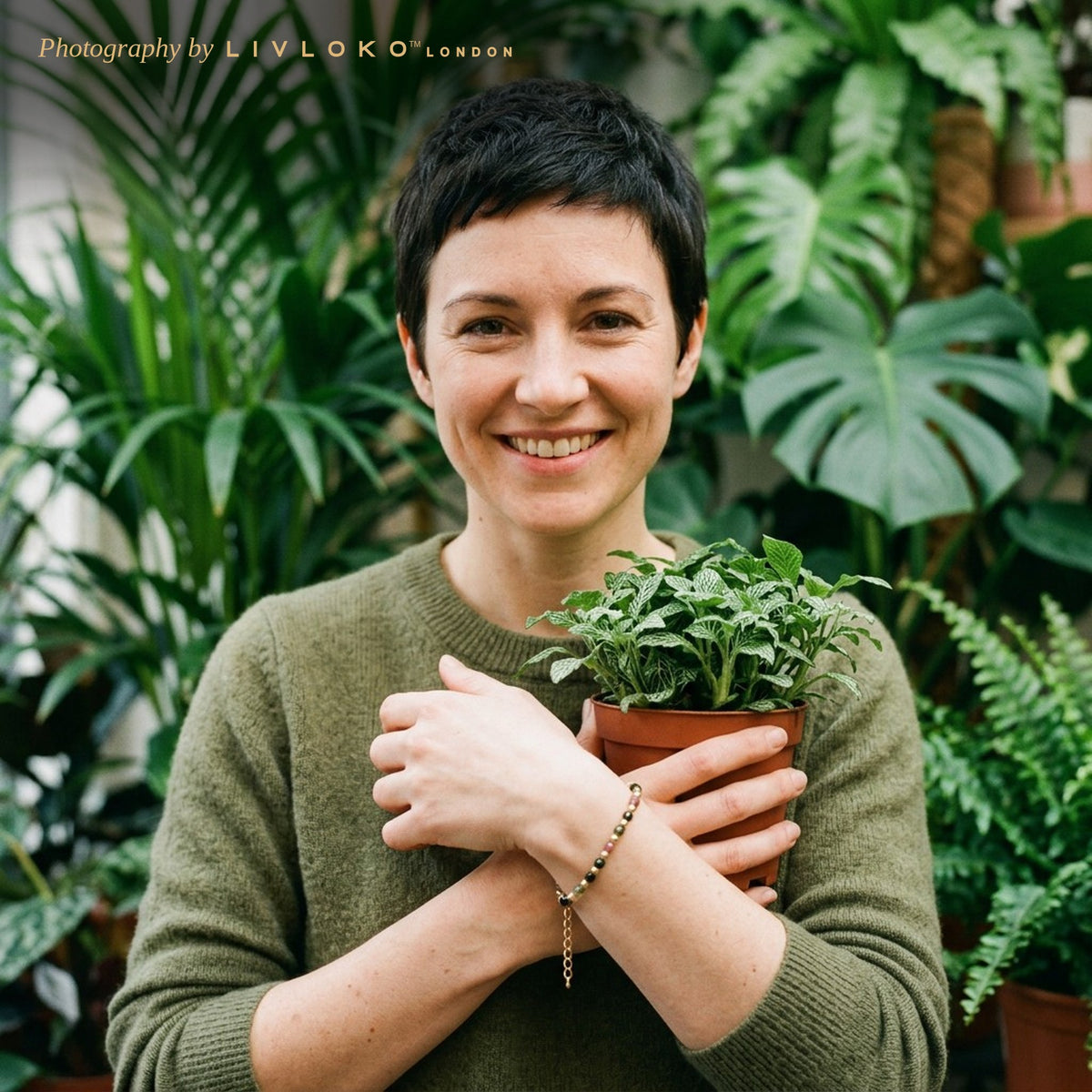 Woman in a plant shop wearing the Livloko London tourmaline crystal bracelet