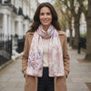 Rose Garden pink floral mulberry silk scarf worn on a London street, by LIVLOKO London