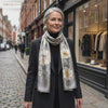 Midnight Blossom grey floral mulberry silk scarf worn in Marylebone, London, by LIVLOKO London