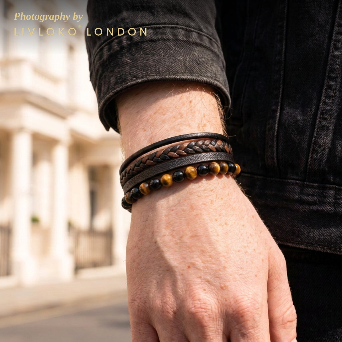 Men's braided leather tiger eye bracelet worn on the wrist in London
