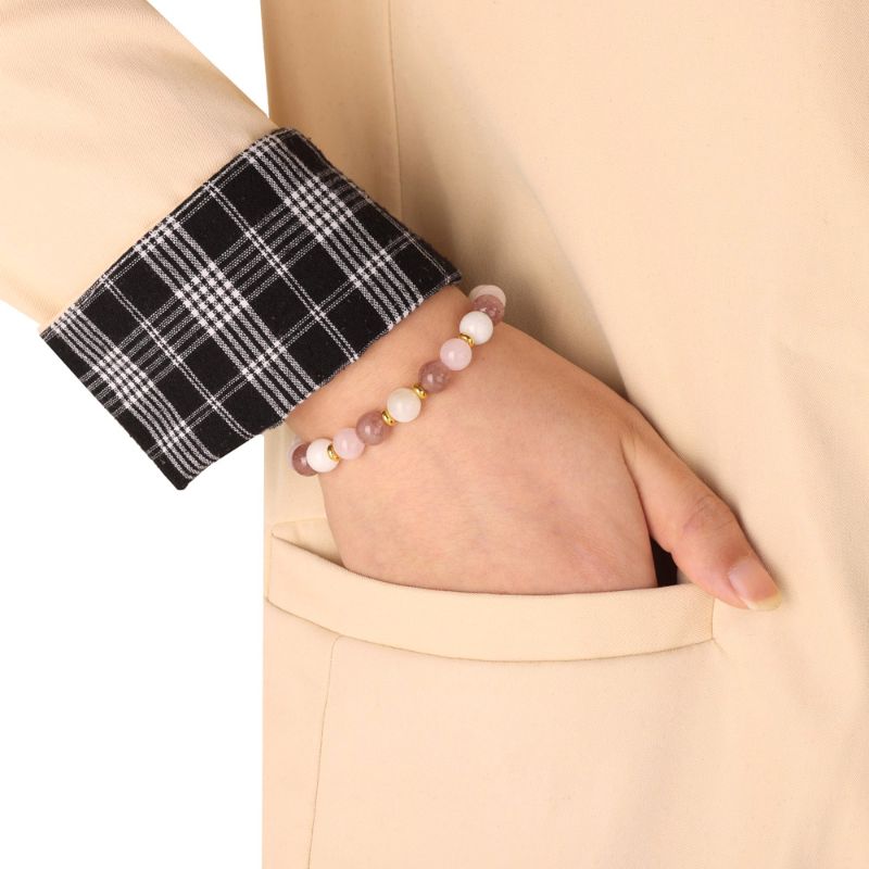 Moonstone, Rose & Strawberry Quartz Crystal Bracelet around woman's wrist