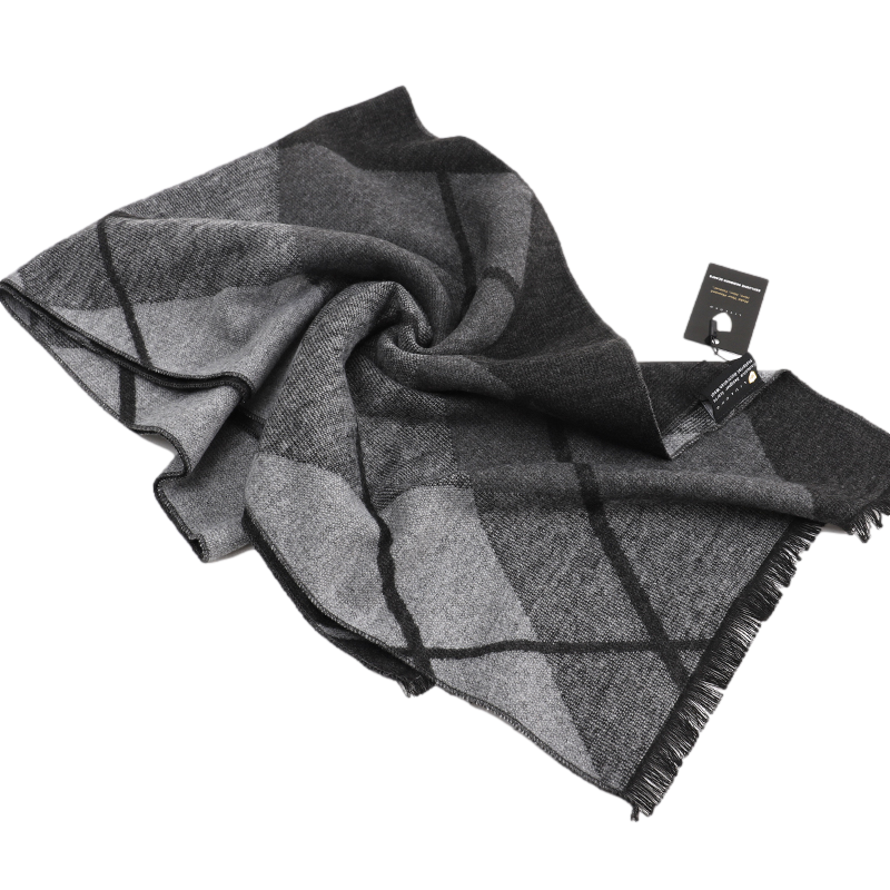 Grey check scarf loosely swirled on a white background with fringed edges and a black swing tag