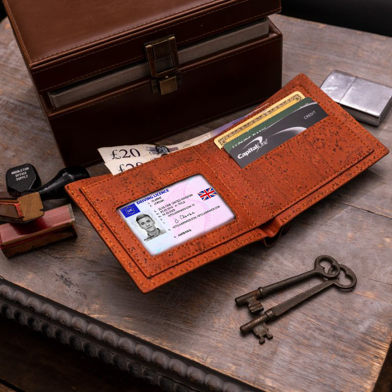 Cork Classic Tan leather wallet opened and placed with 2 keys and a box 