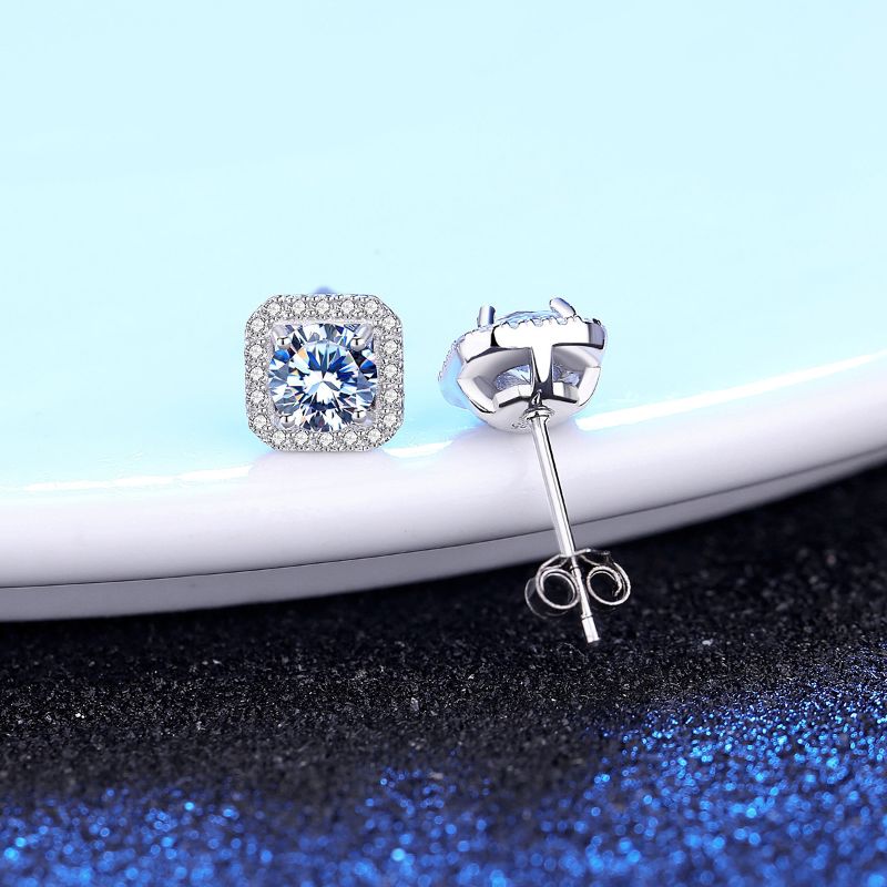 S925 Sterling Silver Moissanite Earrings placed on a white sheet