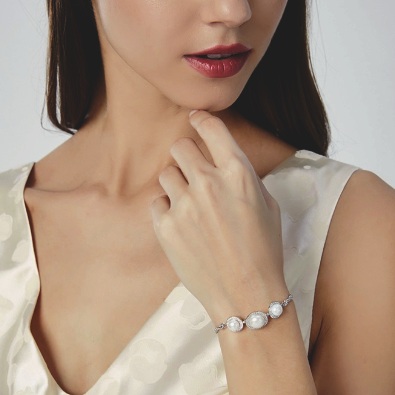 woman posing for a picture wearing S925 Sterling Silver Natural Pearl Bracelet
